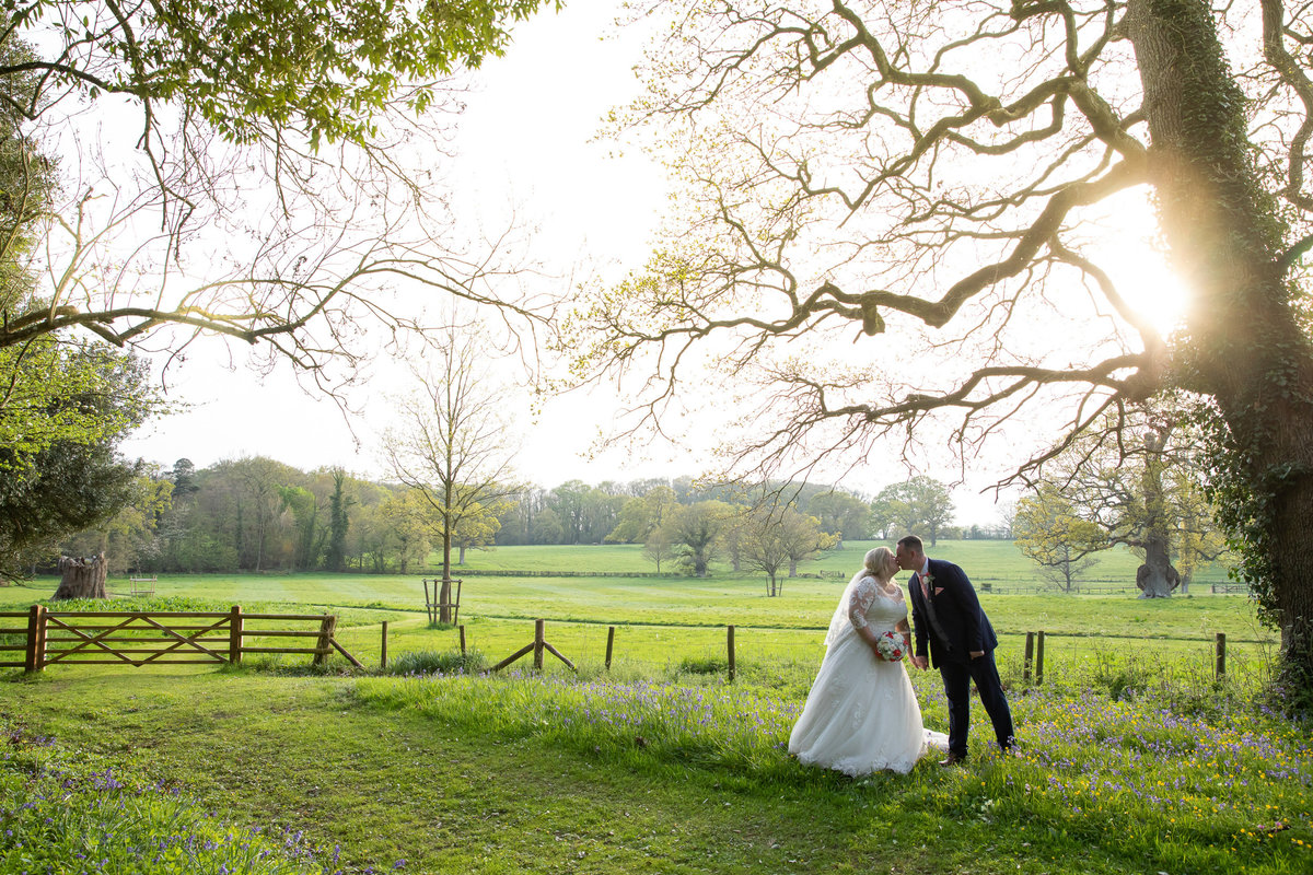 Wedding photo of couple in grounds of Rockbeare Manor Exeter_