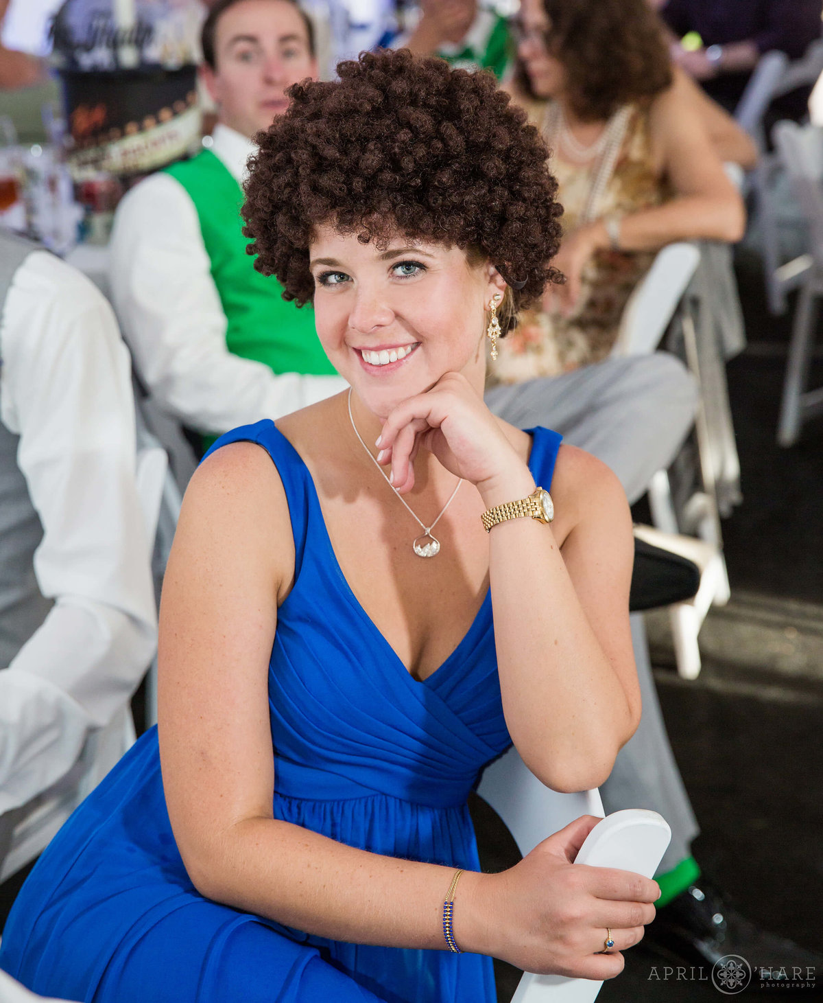 Bridesmaid wearing a silly wig at a Boulder Wedding Reception at Chautauqua Dining Hall