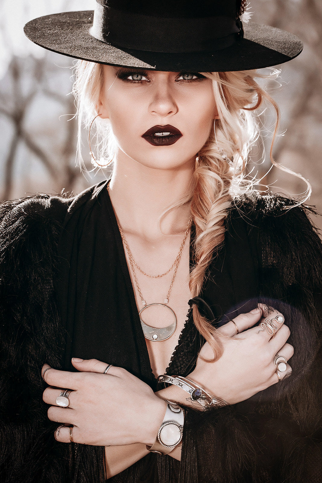 blonde girl with gothic jewelry_