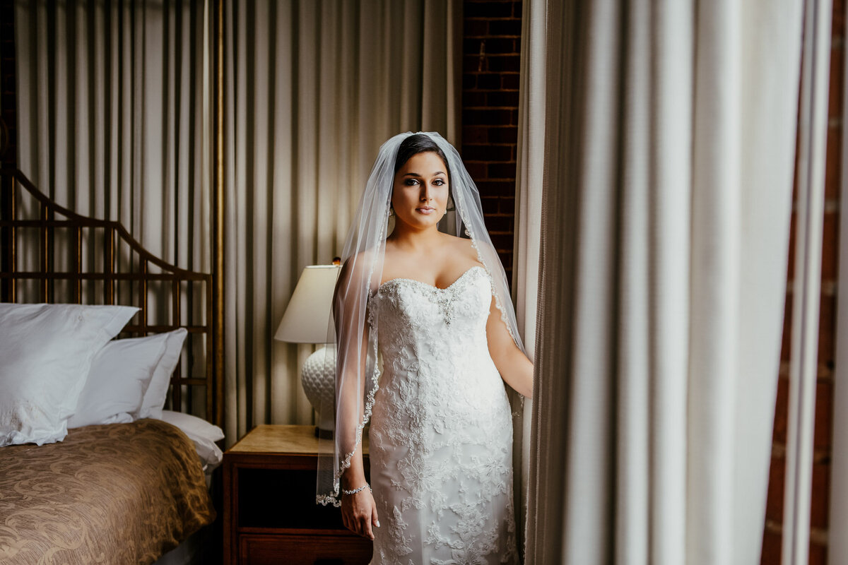 Bride in hotel room getting ready for wedding day