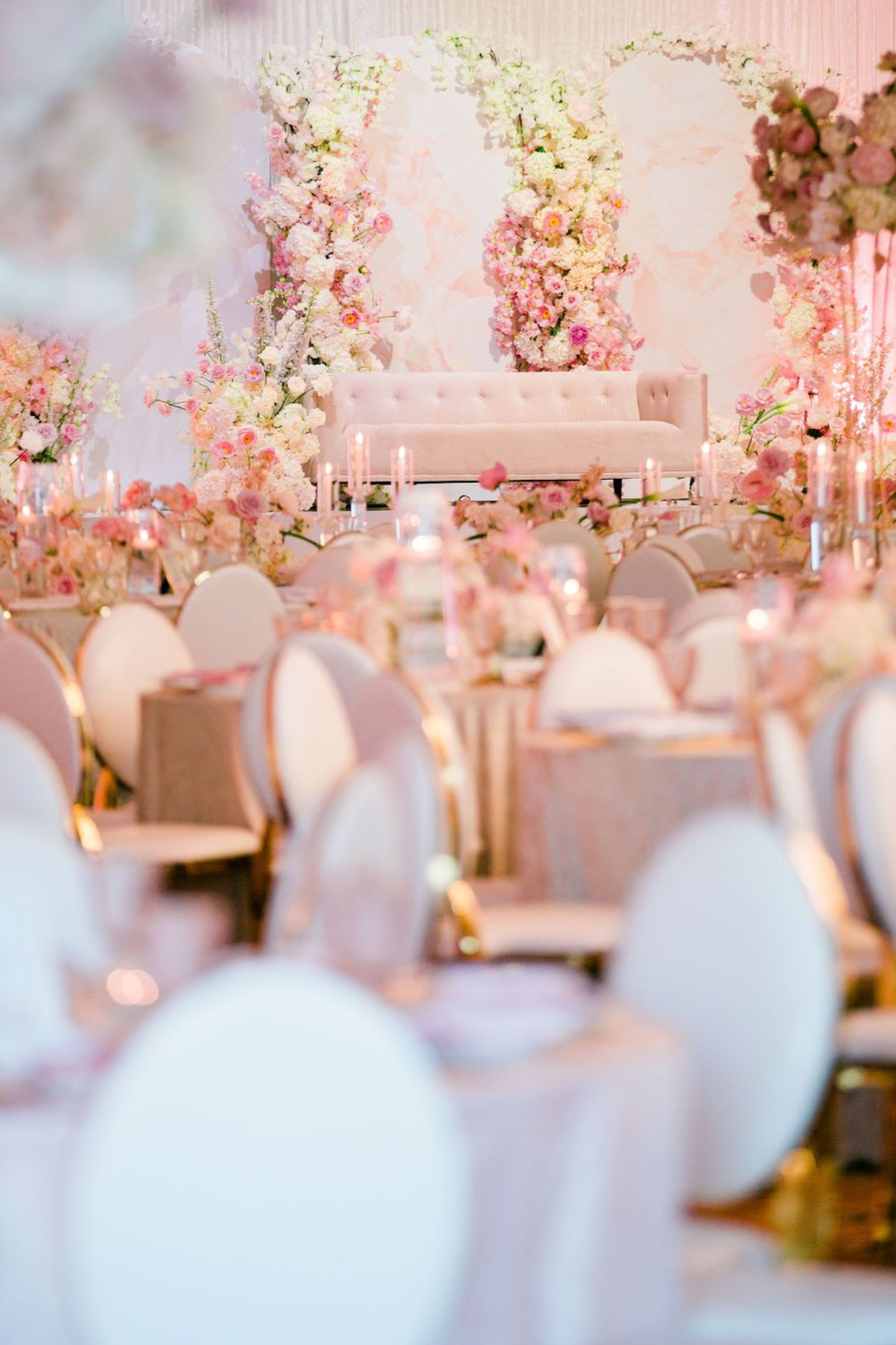 pink-peach-gold-ivory-engagement-party-stage-flower-backrop-sofa