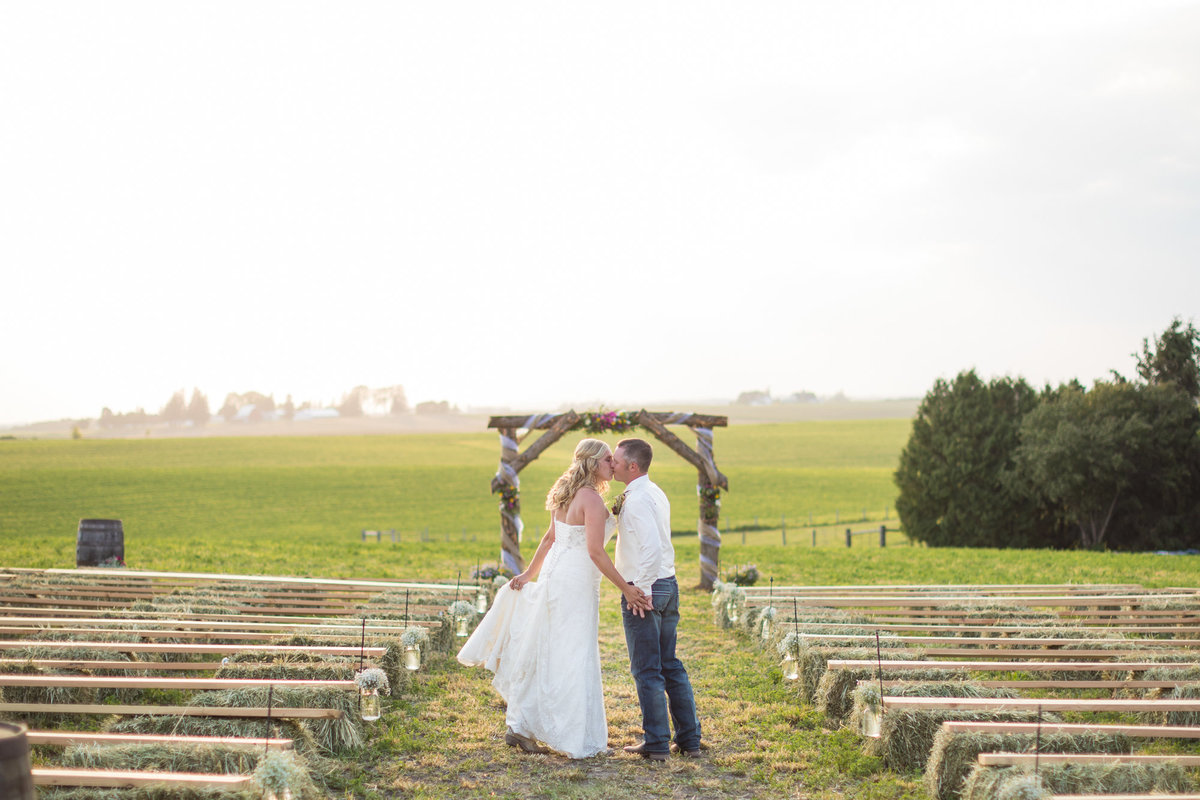 Farm couples are our favorite, especially those who value their cattle and want them integrated into their wedding day.  He built this for her, the arch, the pews, everything.  One of our favorite weddings of the year