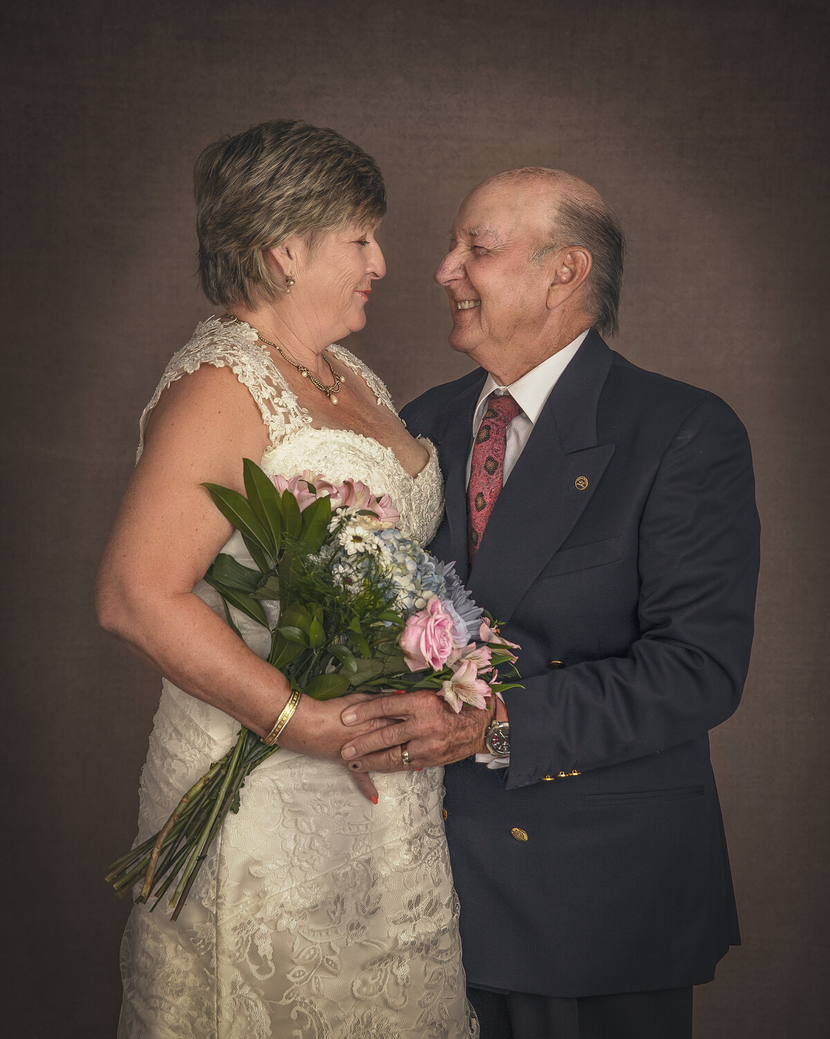 couple gazing into each others eyes in 40 year anniversary portrait session in Ottawa Ontario