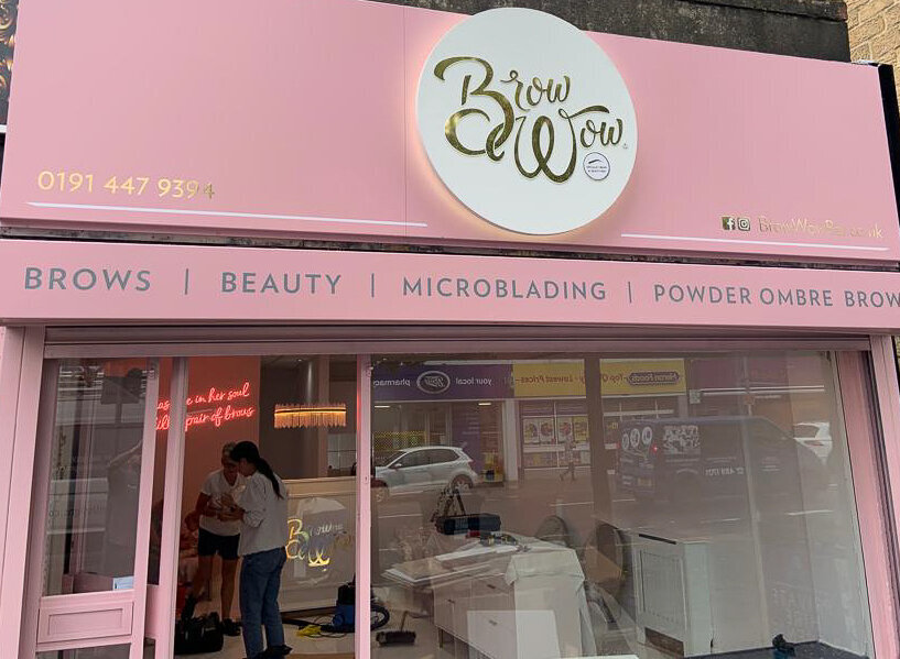 Pink and gold external signage for beauty salon