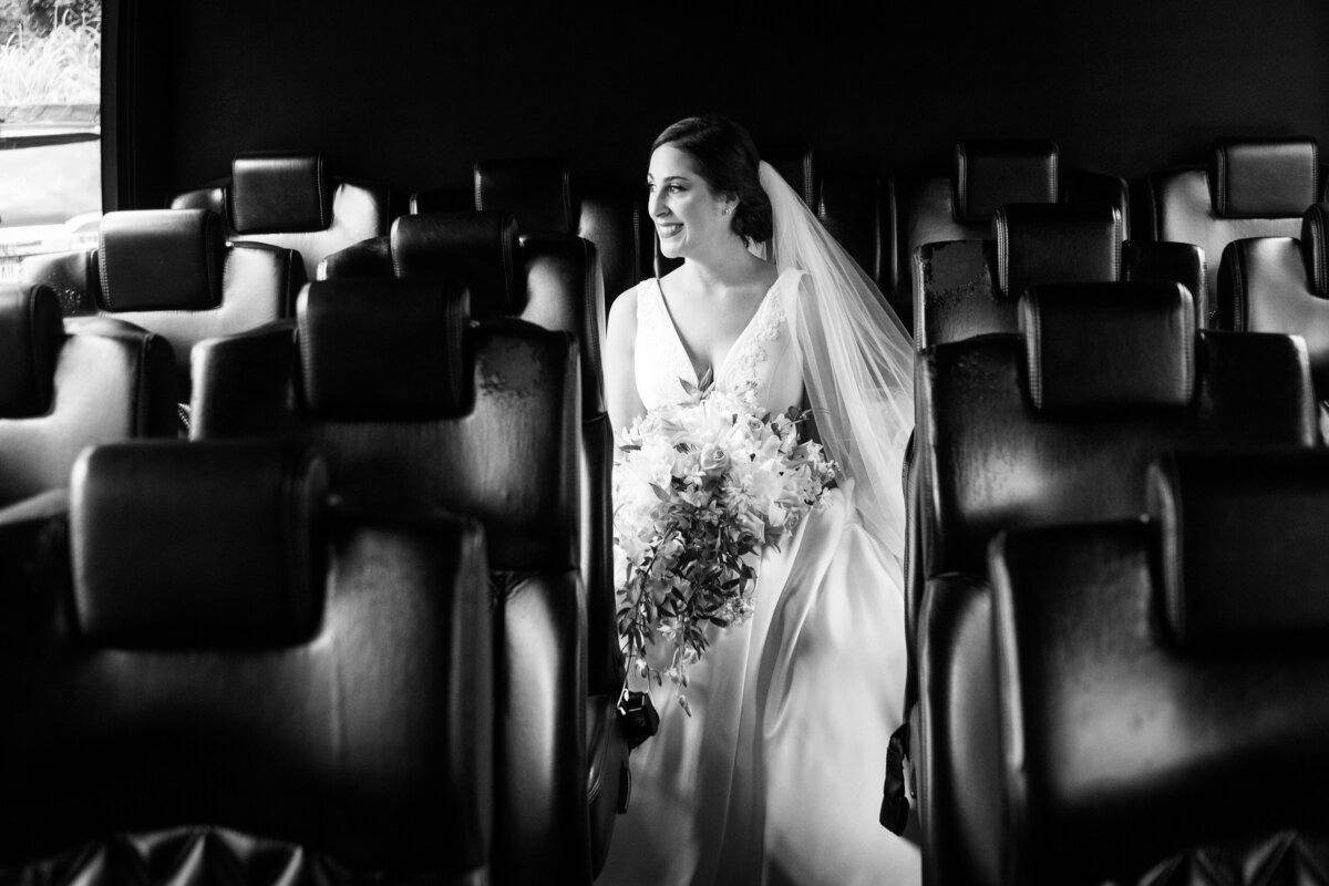 bride-candid-party-bus-excited-bw-nj-marlboro