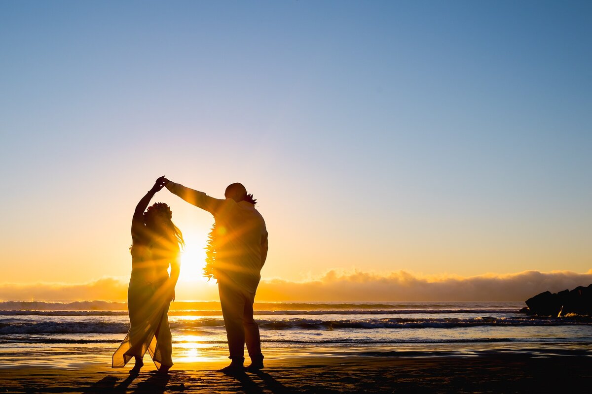 Silhouette of couple dancing at the beach in Coronado