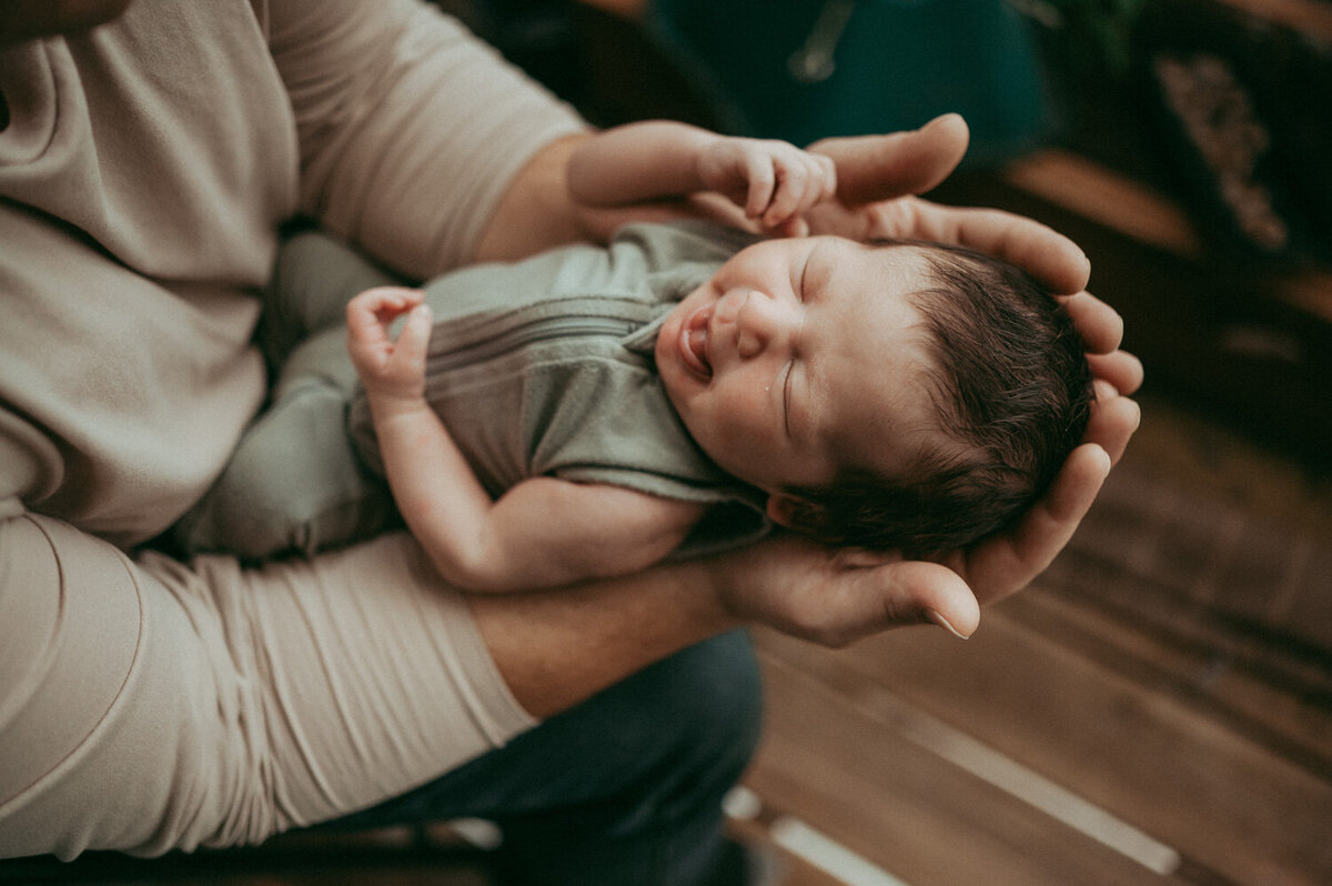 baby and dad photographed by portland newborn photographer evelynne gomes greenberg