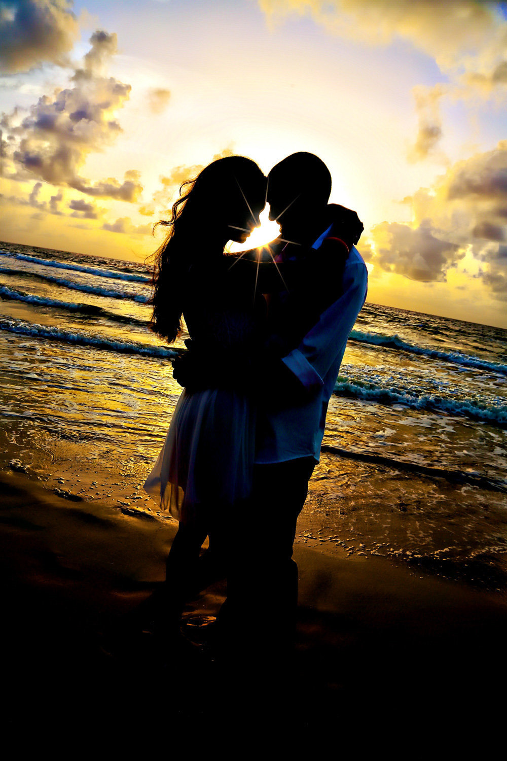 Sunset silhouette couple's picture at the beach. Photo by Ross Photography, Trinidad, W.I..