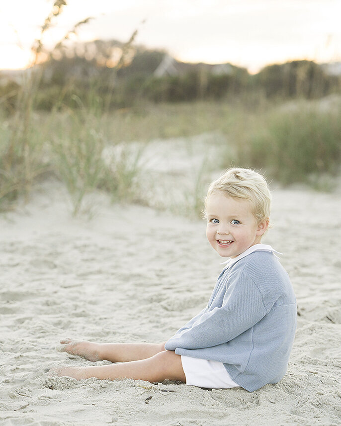 2 year old boy photographed in the beach dunes on st simons island beaches in  a feltman brothers outfit