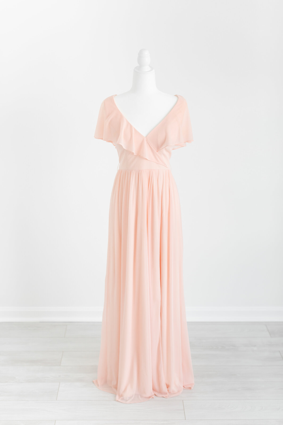 A salmon pink maxi dress with flutter sleeves and a v neck by Washington DC Photographer