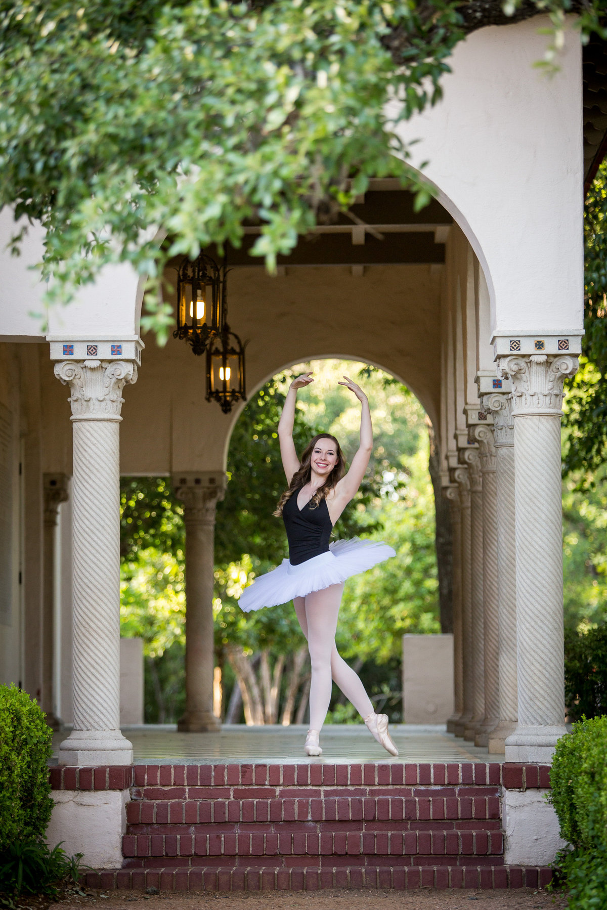 high school senior ballerina wearing tutu at Landa Library by San Antonio senior photographer