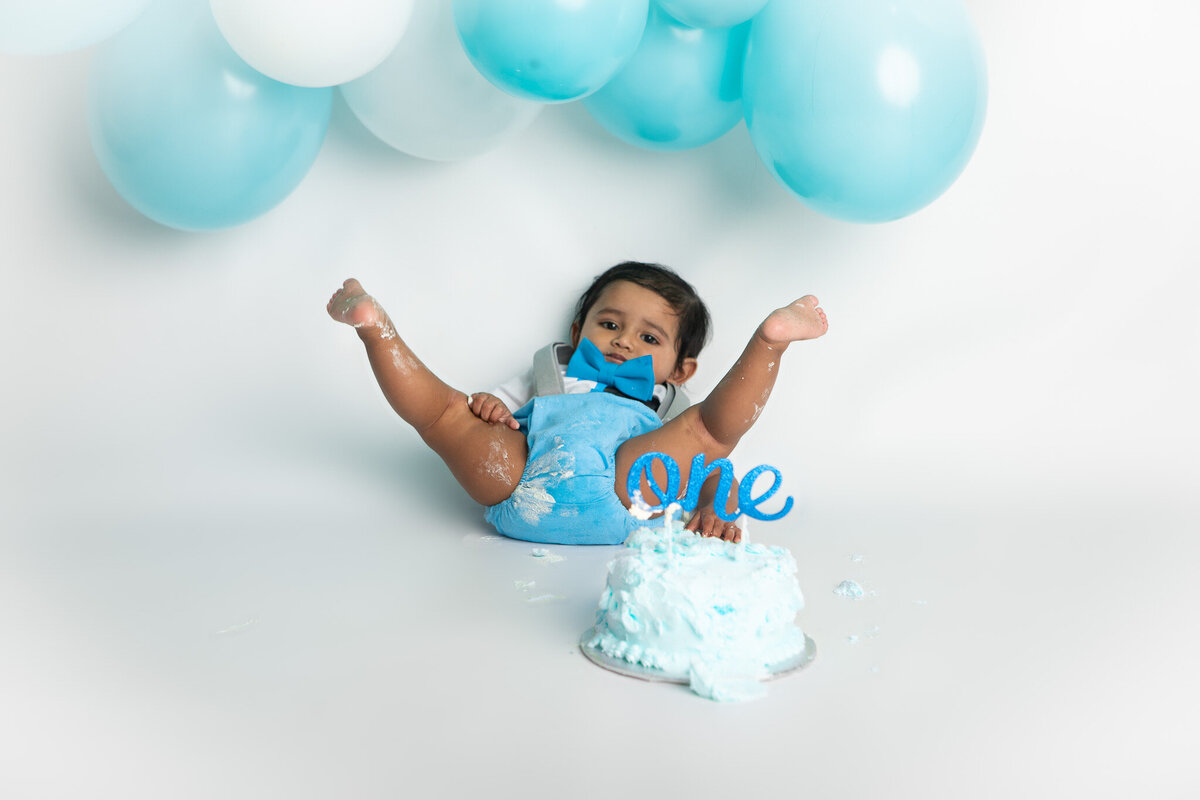 Baby eating a blue cake