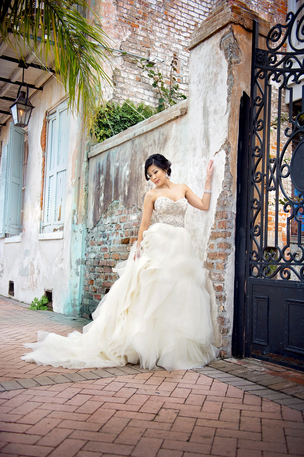 Bride with gas lanterns and brick wall