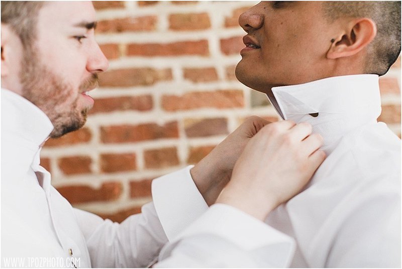 Grooms tying a bow tie