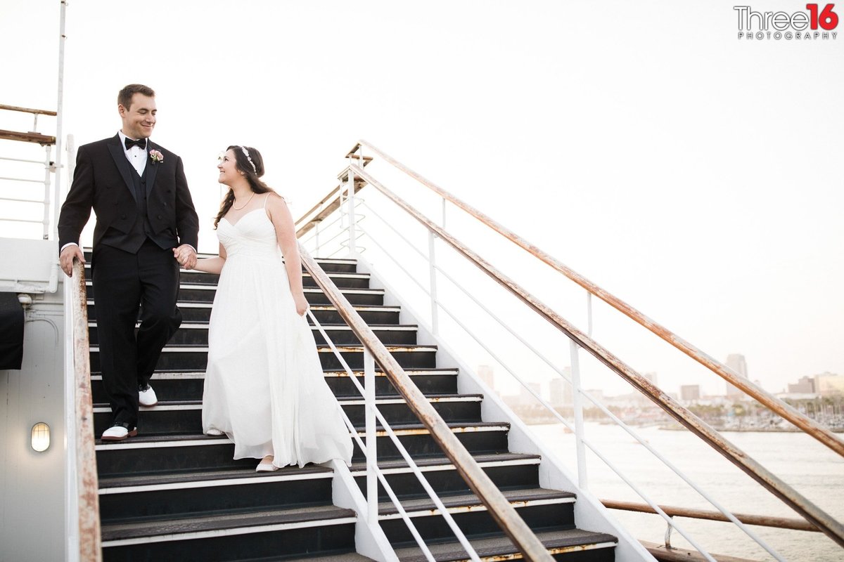 Bride and Groom pose on the stairwell