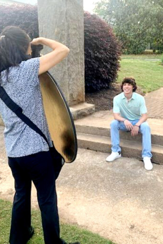 Behind the scene of a senior portrait session.