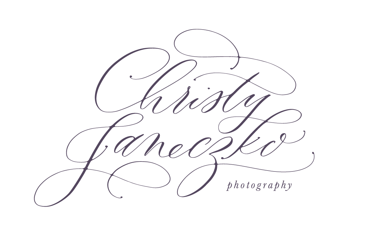 Purple script logos spelling out "Christy Janeczko Photogeraphy"