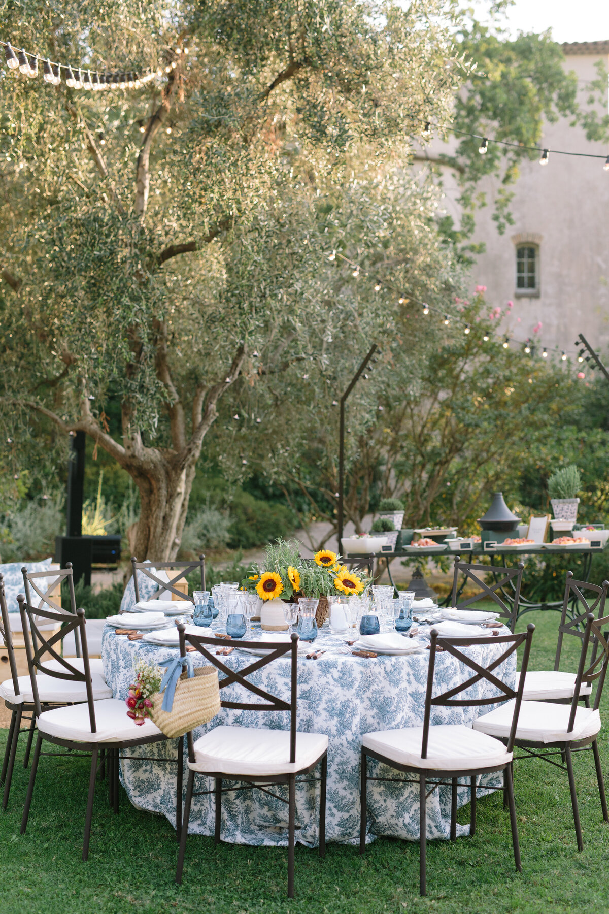 Boho tablescape, outdoor welcome dinner, sunflower centerpieces