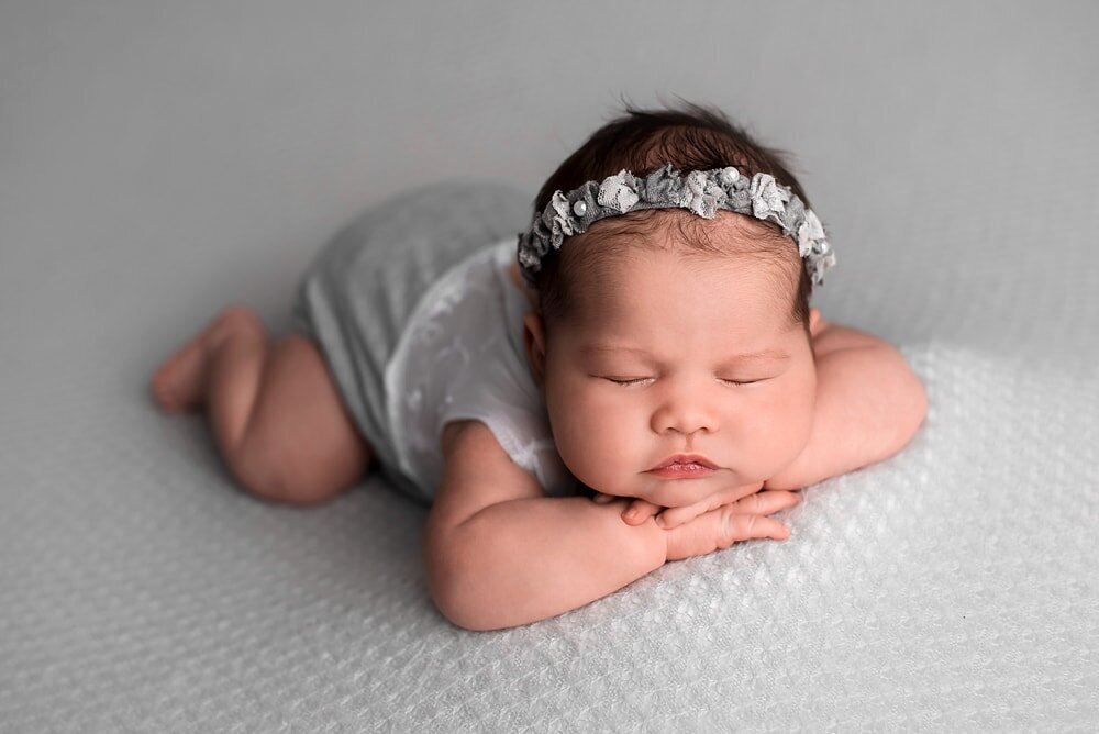 vancouver-newborn-photographer_baby-girl_chin-on-hands-beanbag-grey