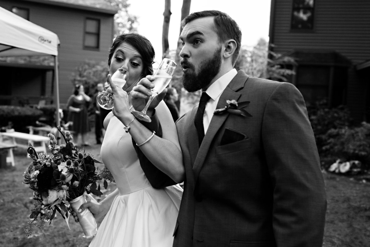 The newlyweds toast after their intimate wedding in Newmarket NH
