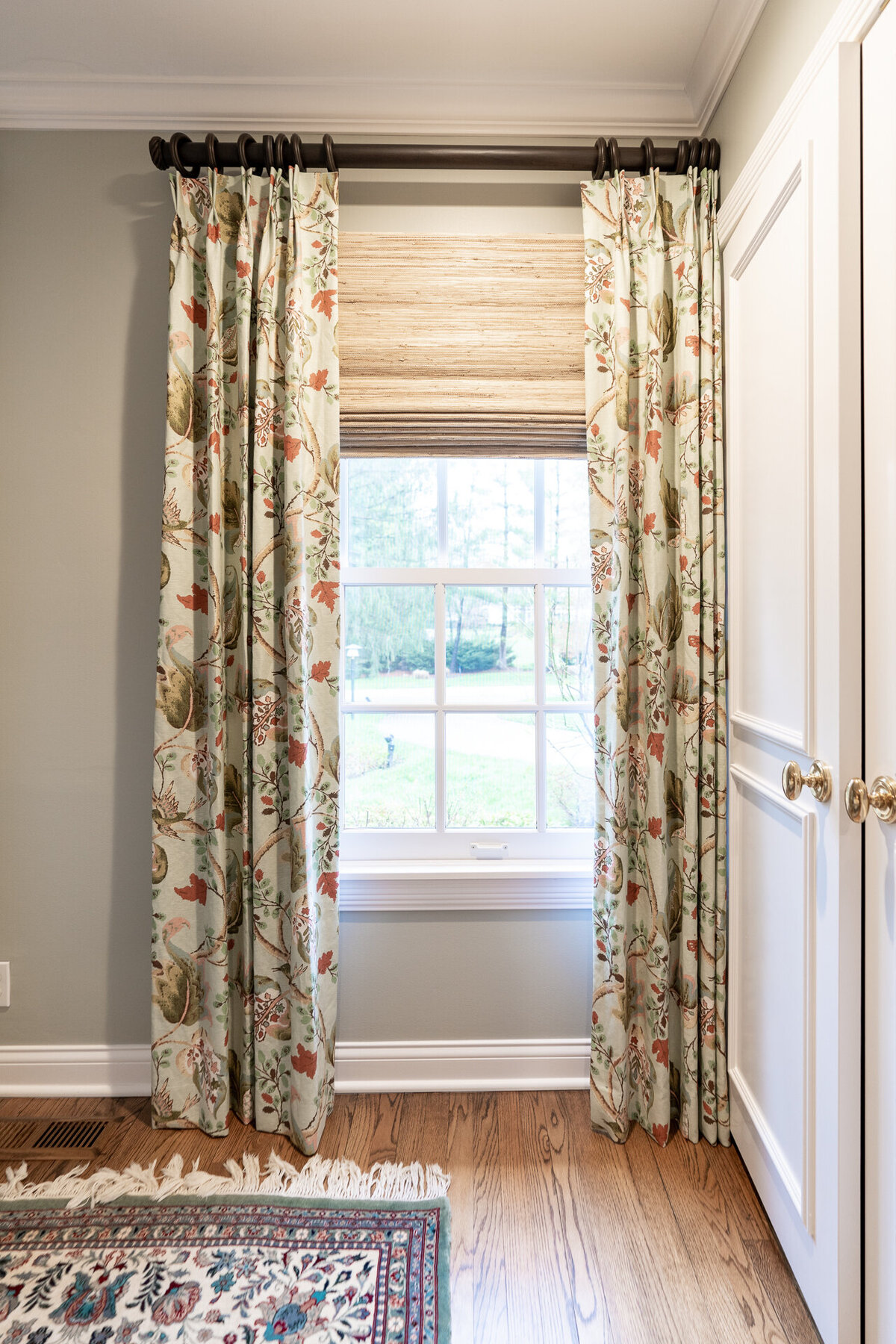 curtains with a green and red botanical pattern