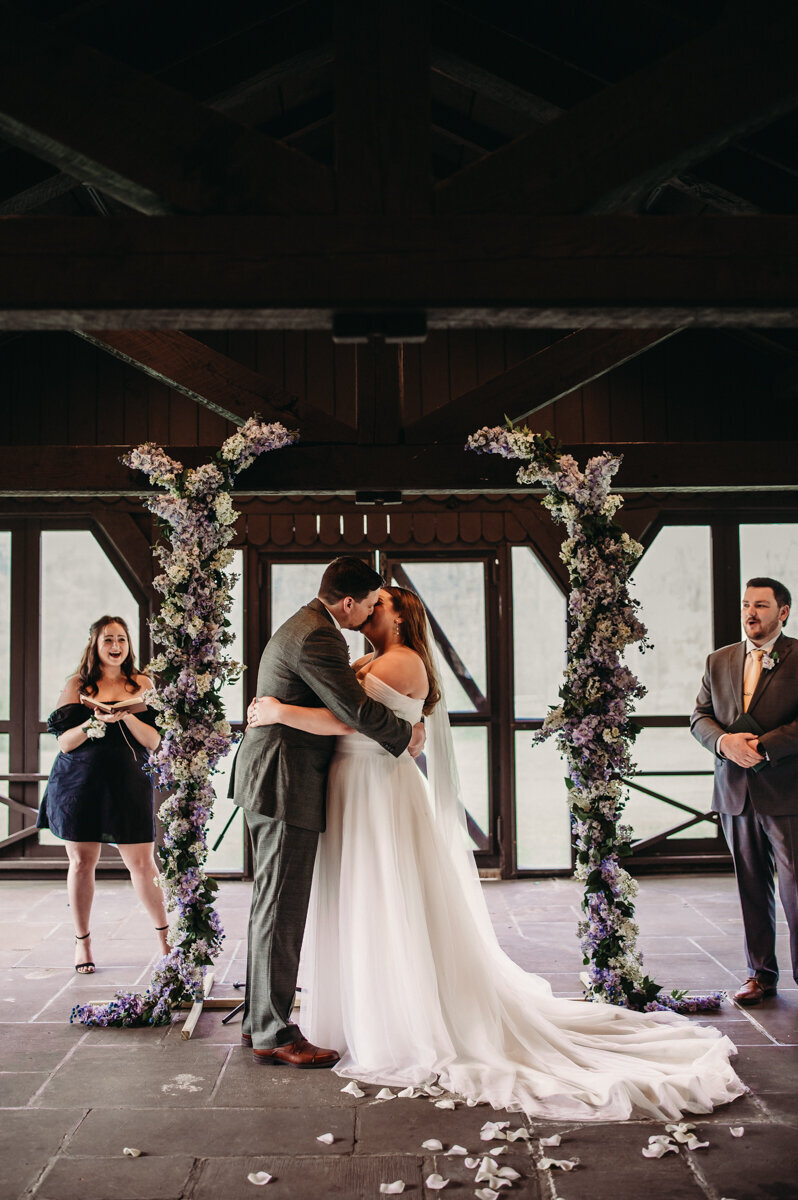 Couple kiss at Ceremony inside Happy days Lodge Ohio