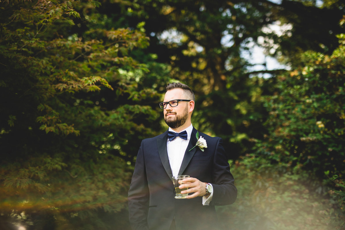 grooms portrait with whisky