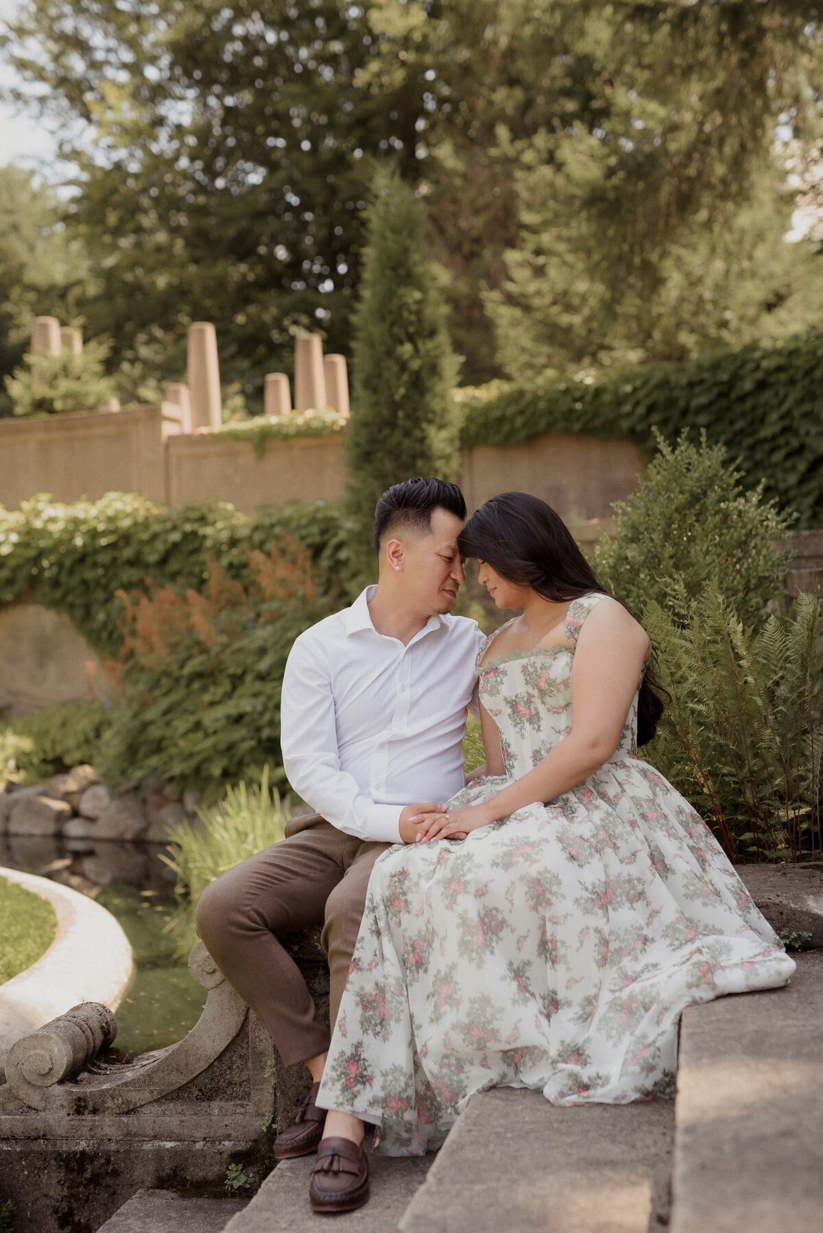 crane estate engagement session with asian couple on a hot summer day. strolling through the gardens to the great house in Massachusetts.