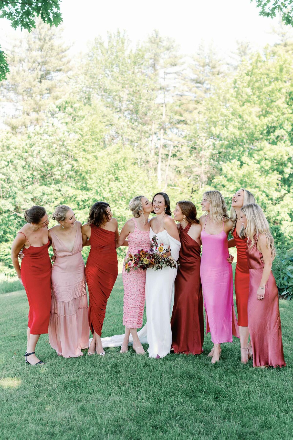 colorful pink bridesmaids laughing