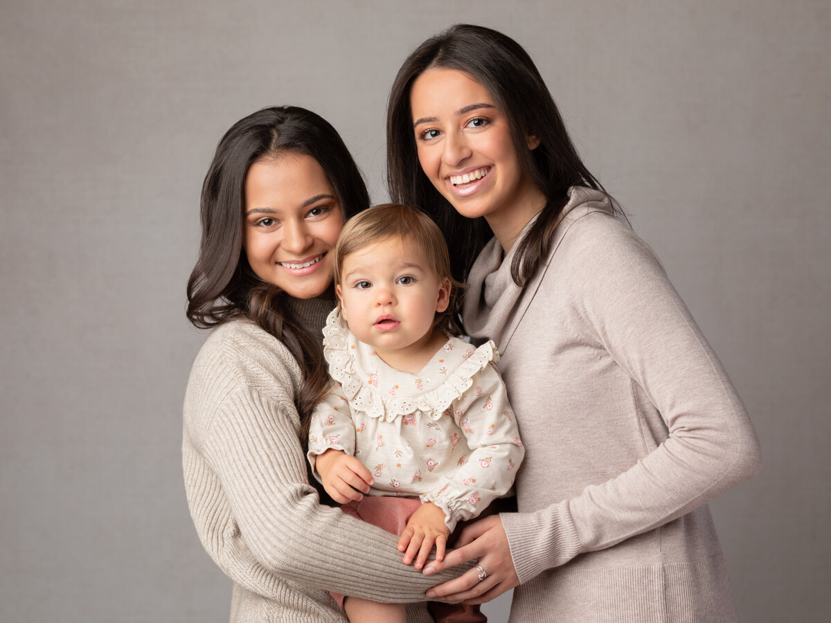 three girls posing for family studio portraits cleveland family photography
