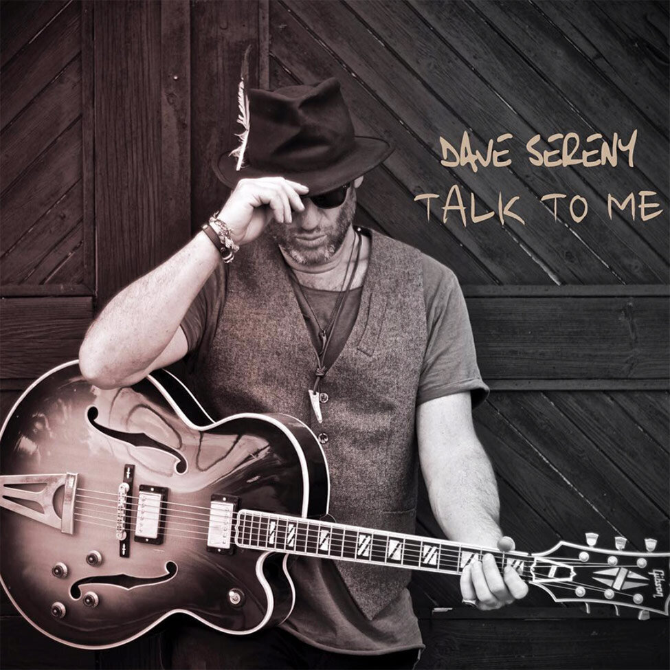 Single Cover Title Talk To Me Artist Dave Sereny holding guitar and brim of his fedora looking down while wearing sunglasses