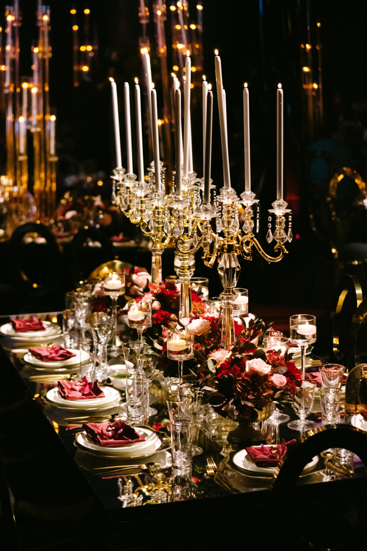black-gold-burgundy-red-tent-reception-chandeliers-roses-candelabras-candle-napkin