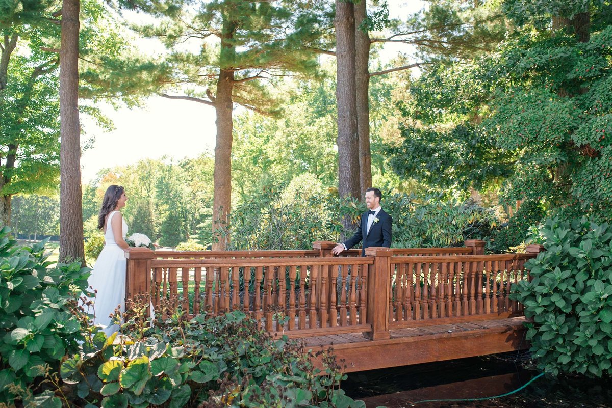 Bride and groom first look on the bridge at Stonebridge Country Club