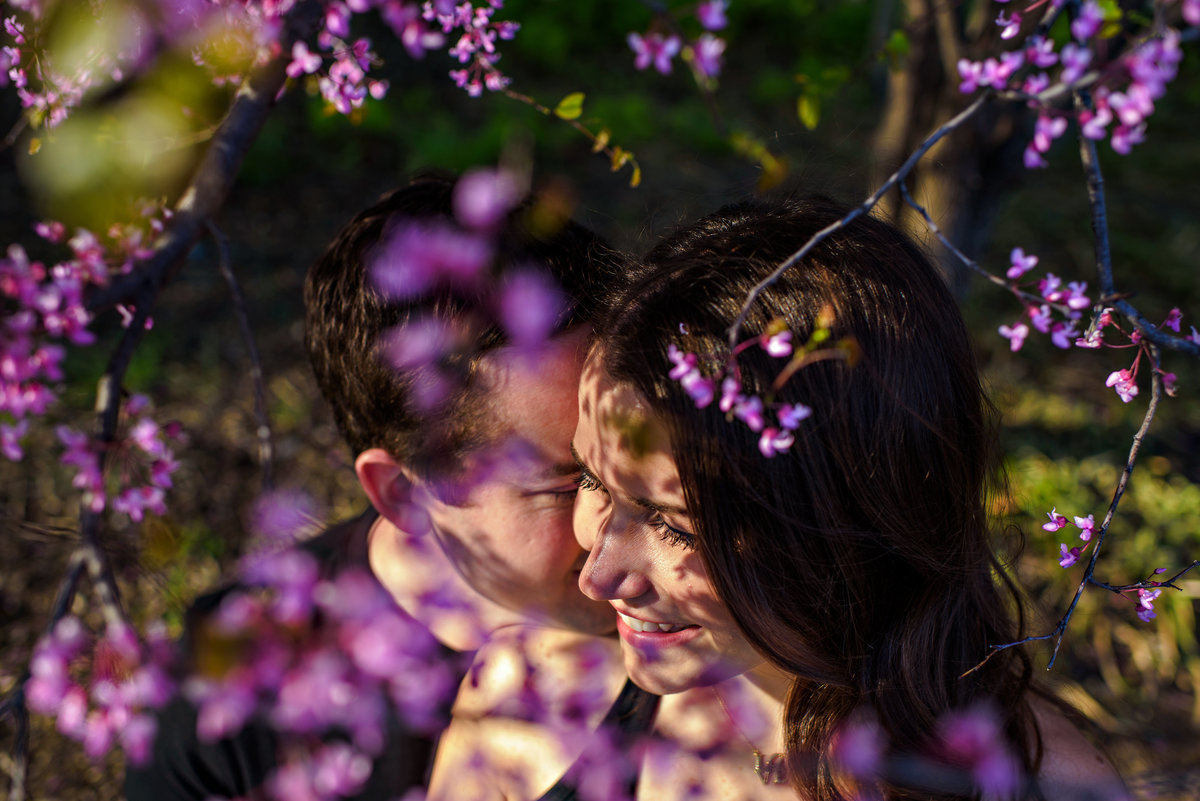 Flowers cast shadows on a couples faces.