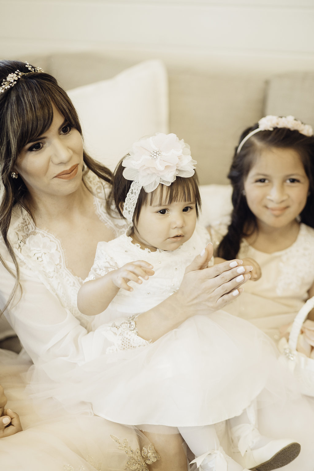 Wedding Photograph Of Woman Clapping While Carrying a Toddler Los Angeles