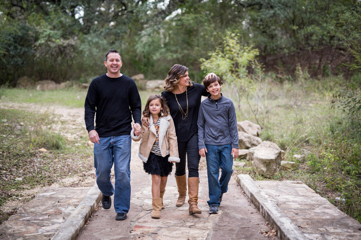 family walking on a bridge at Walker Ranch by San Antonio photographer Expose The Heart