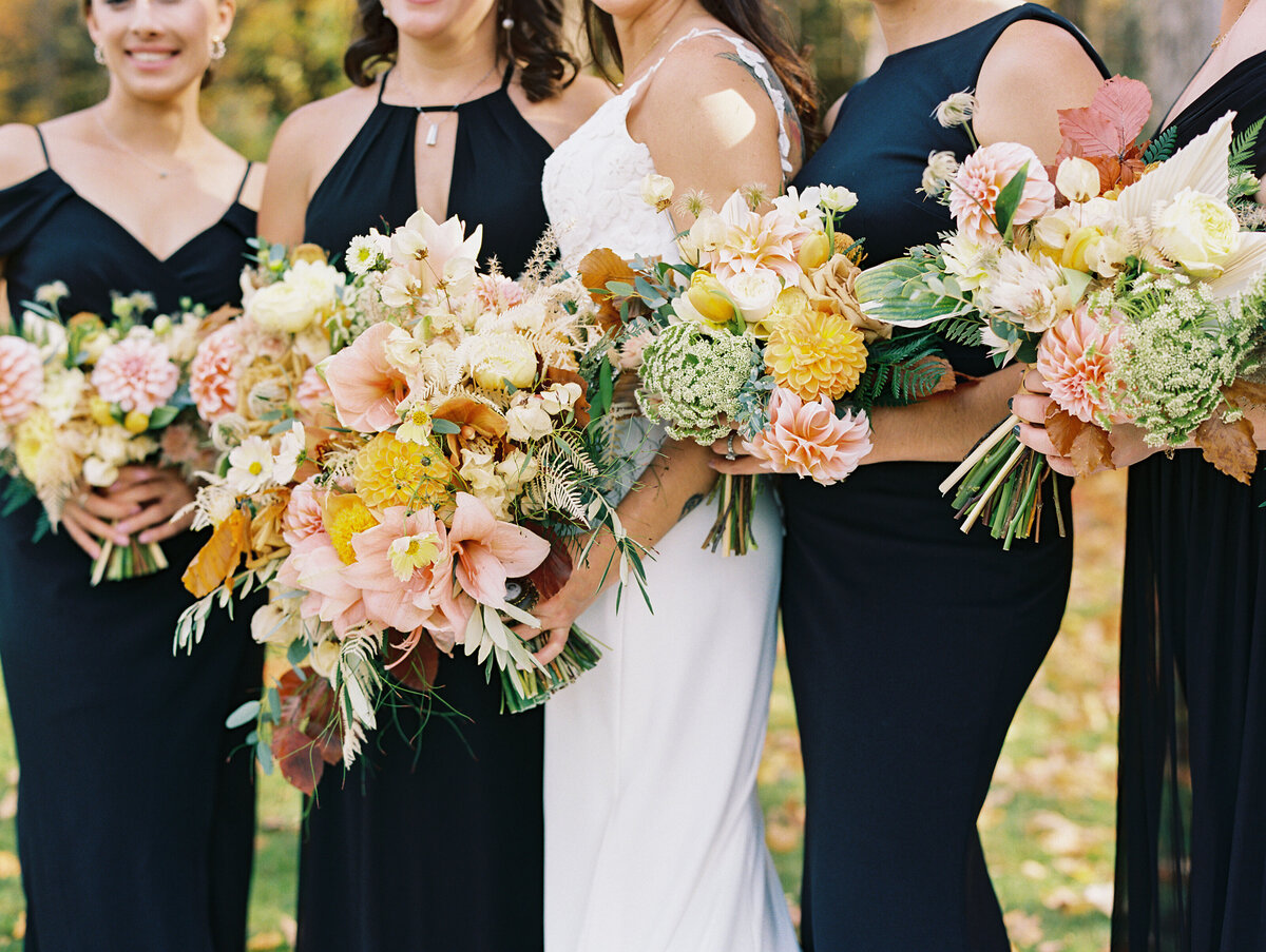 bride and bridesmaids holding fall bouquets by Clementina Floral Co.