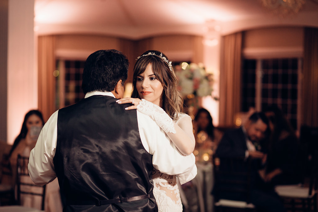 Wedding Photograph Of Bride Looking And Dancing With The Man In Black Suit Los Angeles