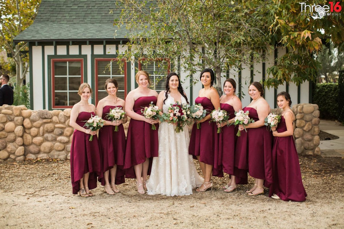 Bride poses with her seven bridesmaids