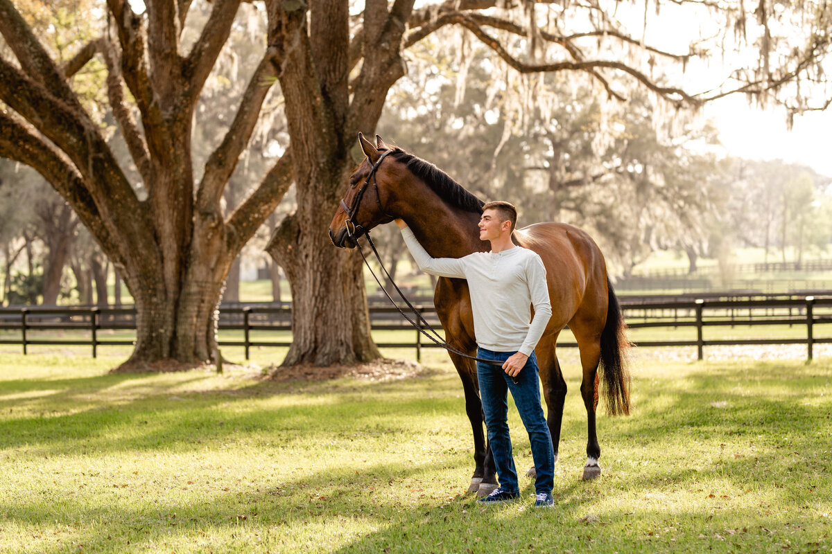 Man with his jumper horse photographed at gorgeous farm in Ocala, FL by pro horse photographer.
