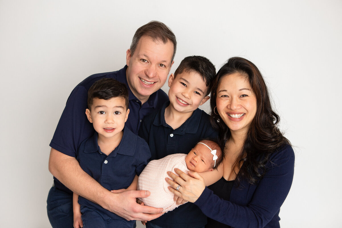 Family of 5 newborn and family pose