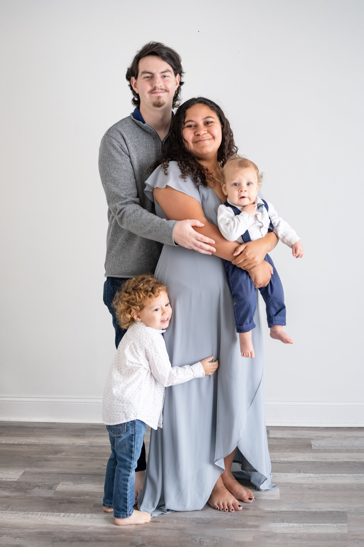 A family picture of mom, dad, big brother, and baby brother