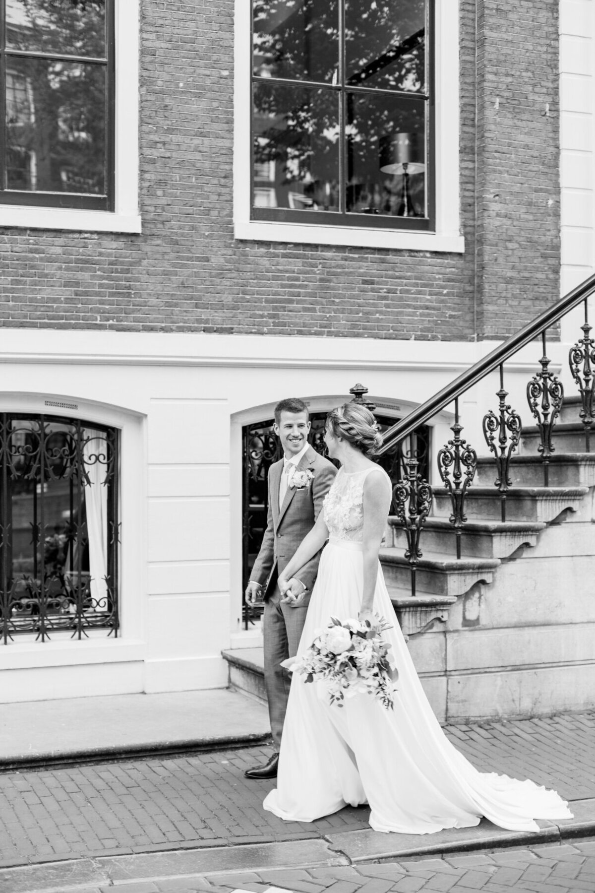 Black and white wedding portrait of the bride and groom in Amsterdam for their city elopement for a photoshoot organized by Lovely & Planned