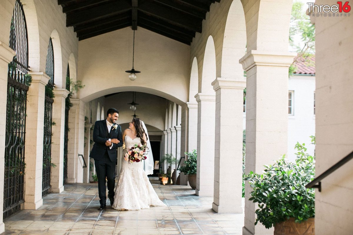 Newly married couple walk the corridor at the Ebell of Los Angeles