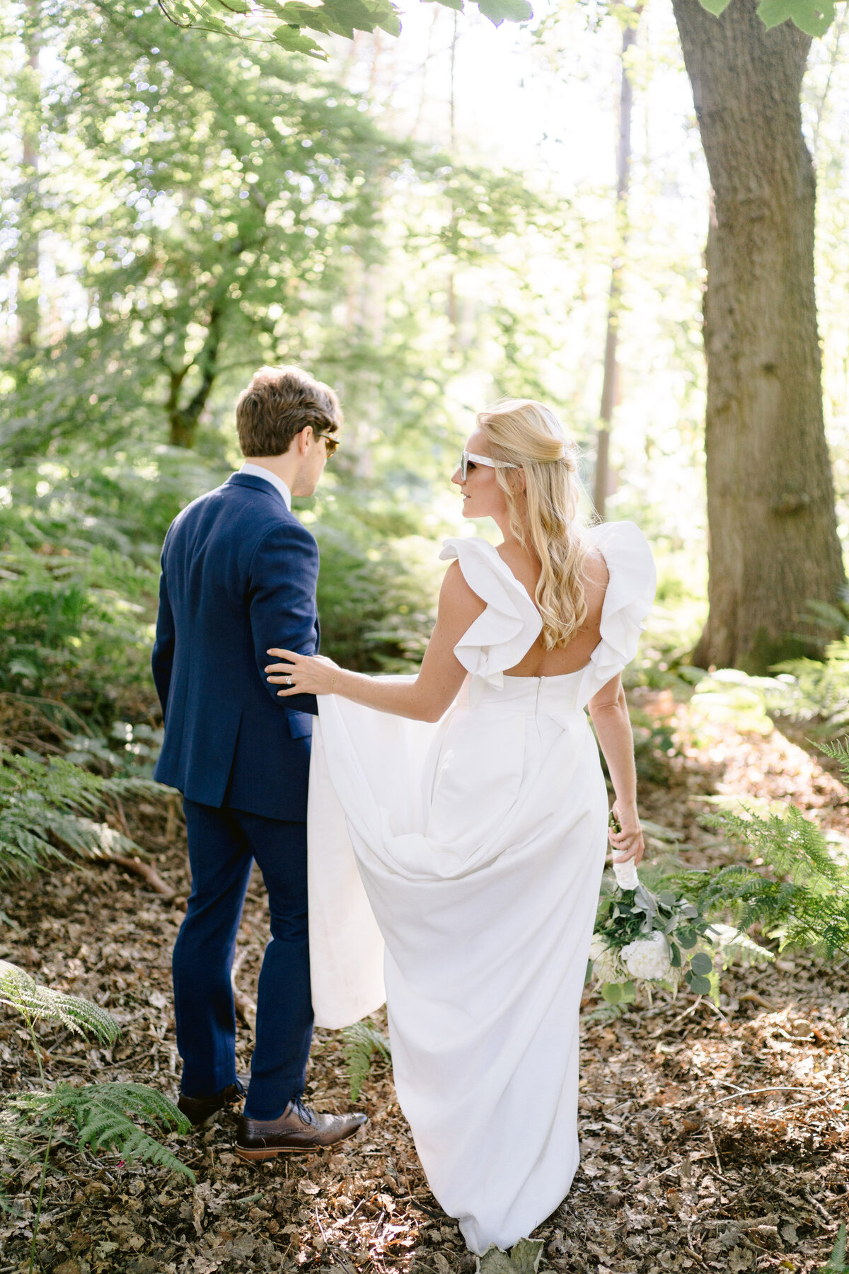 bride and groom in the woods at peckforton castle