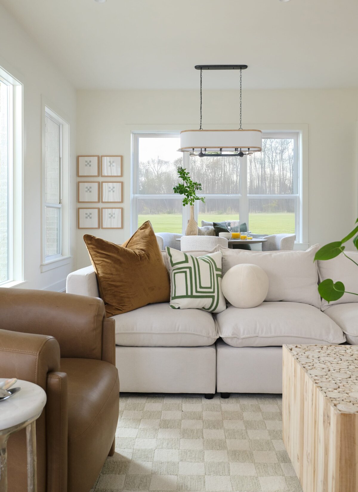 cocoloba homes graham living room with sofa and leather brown chair