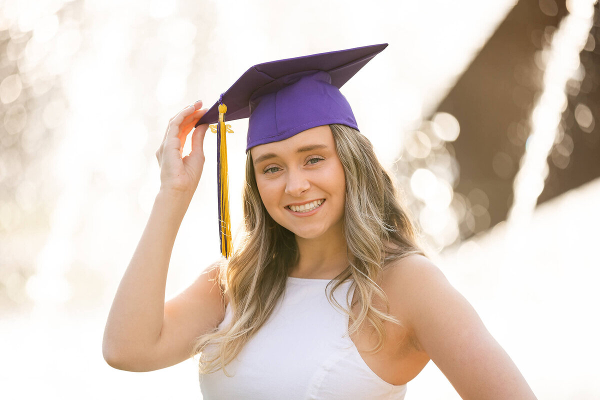 Senior MSU Student donning her graduation cap during her college graduation session in Mankato, MN.