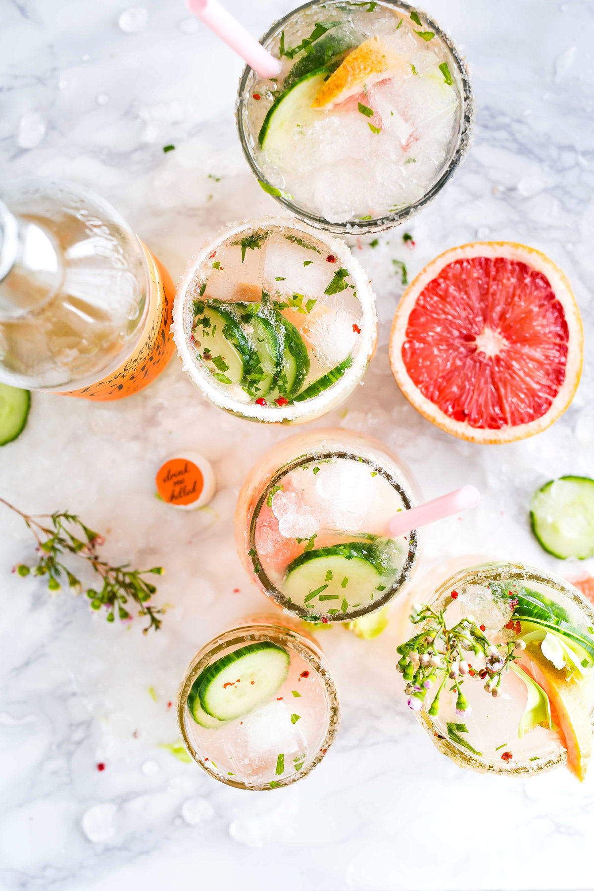 Brightly colored craft cocktails with cucumber & grapefruit