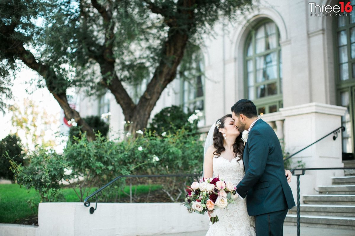 Bride and Groom share a kiss in front of the Ebell of LA