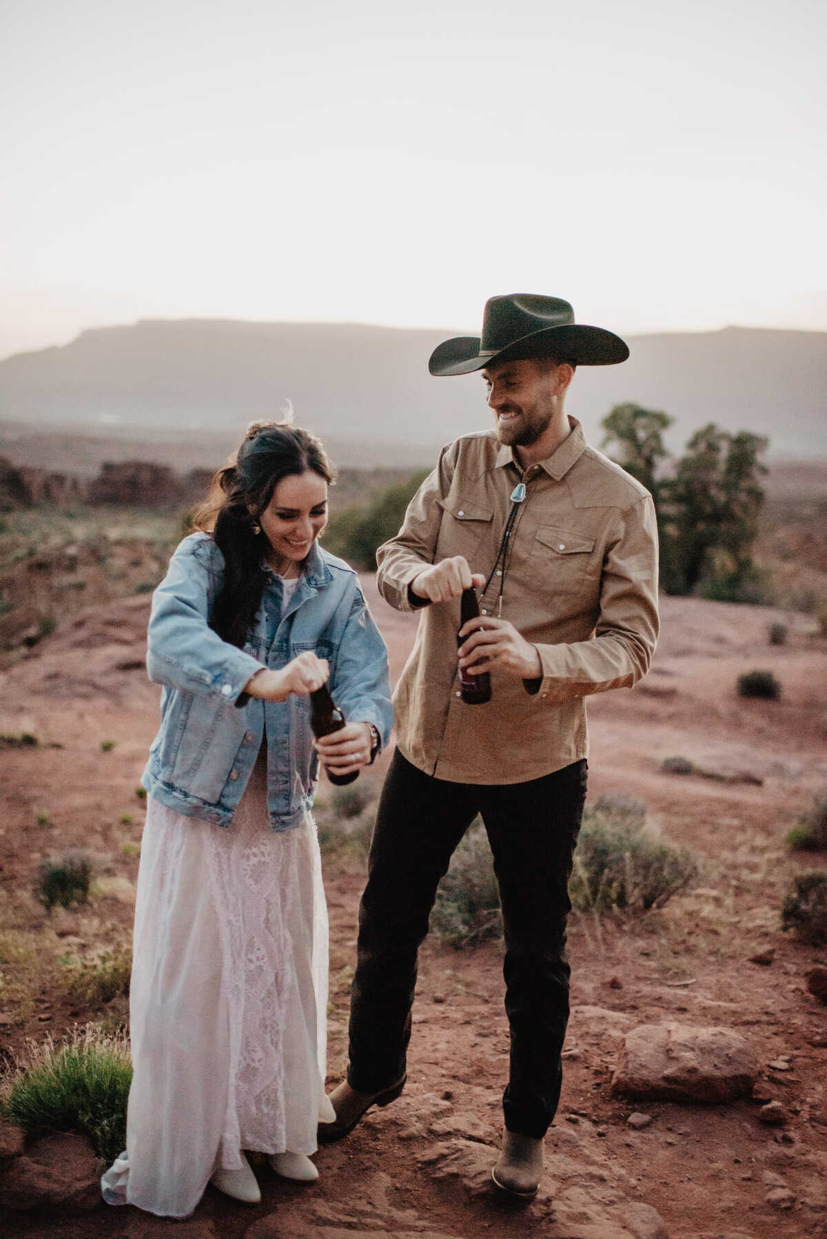 Utah Elopement Photographer captures couple celebrating Moab elopement with beer